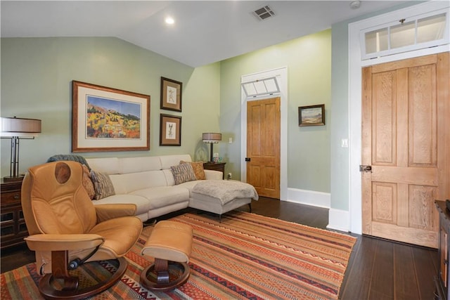 living room with lofted ceiling and dark wood-type flooring