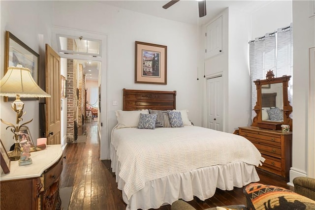 bedroom featuring dark hardwood / wood-style floors, a closet, and ceiling fan