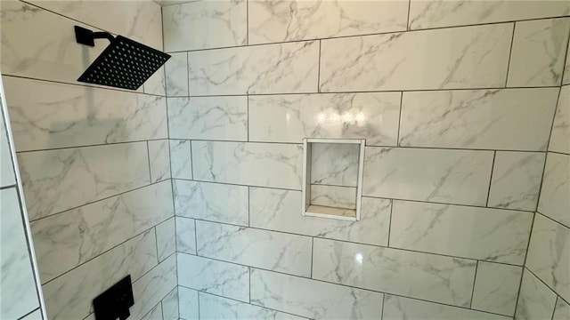 details featuring a tile shower