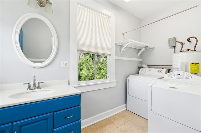 laundry room with washer and clothes dryer, electric water heater, sink, and light tile patterned floors