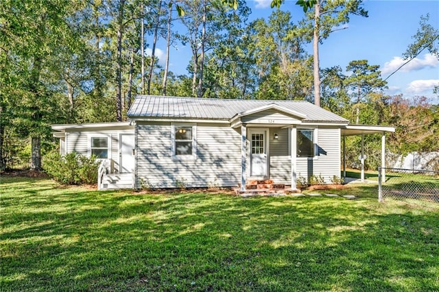 ranch-style home featuring a front yard and a carport