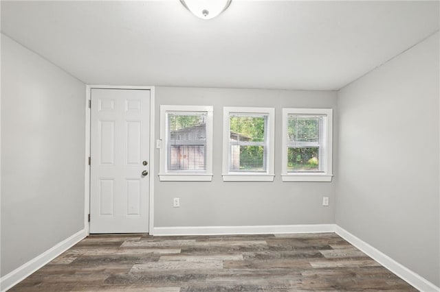 unfurnished room featuring dark hardwood / wood-style floors