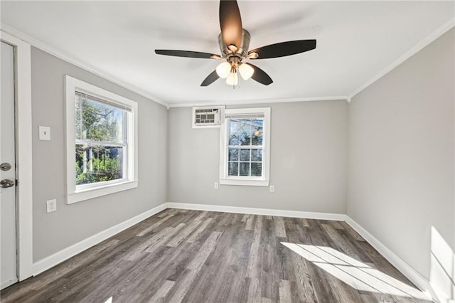 spare room featuring a wall unit AC, ceiling fan, wood-type flooring, and ornamental molding