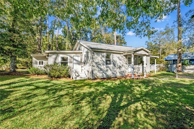 view of front of home with a front yard