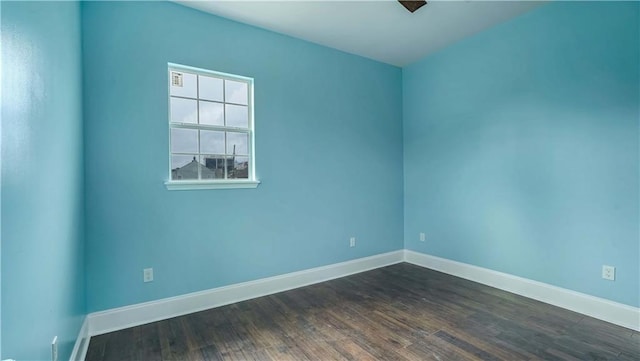 empty room featuring dark hardwood / wood-style floors