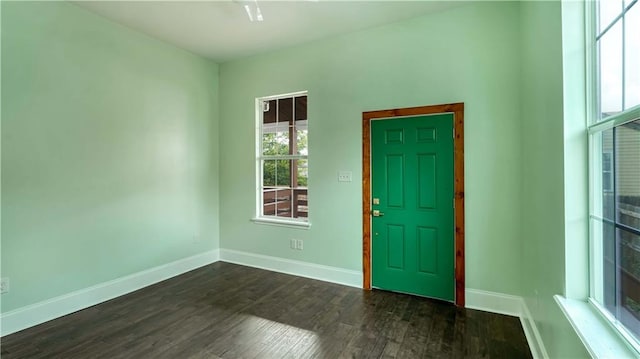 entryway with dark hardwood / wood-style floors