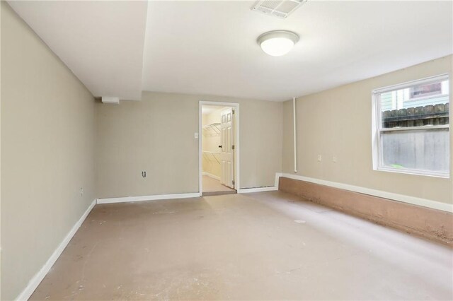 2808 Octavia St, New Orleans, LA 70115 - spare room with baseboards and concrete floors