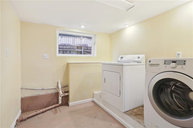 washroom featuring washer and dryer