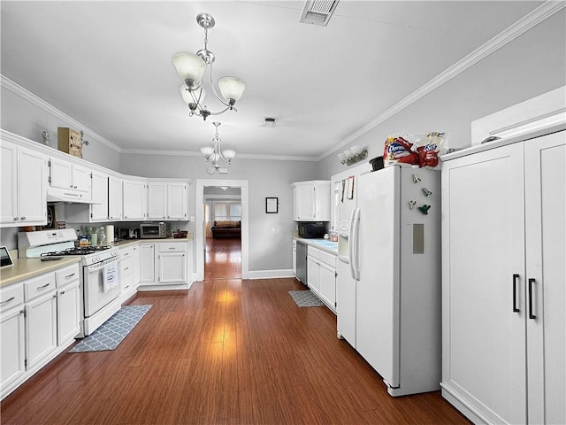 kitchen featuring white cabinets, white appliances, an inviting chandelier, and hanging light fixtures