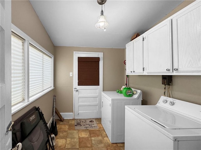 laundry room with cabinets and washing machine and clothes dryer