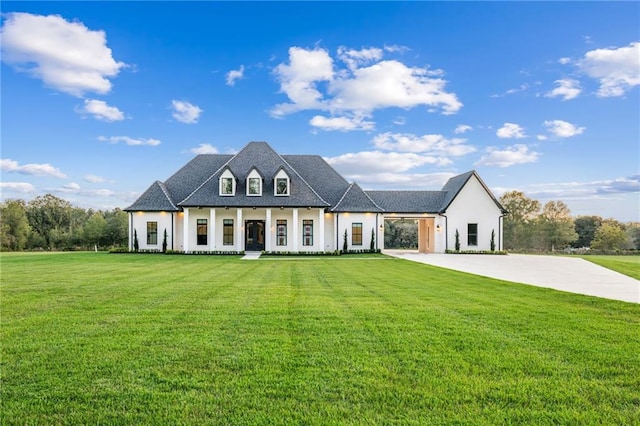 french country style house with a front yard