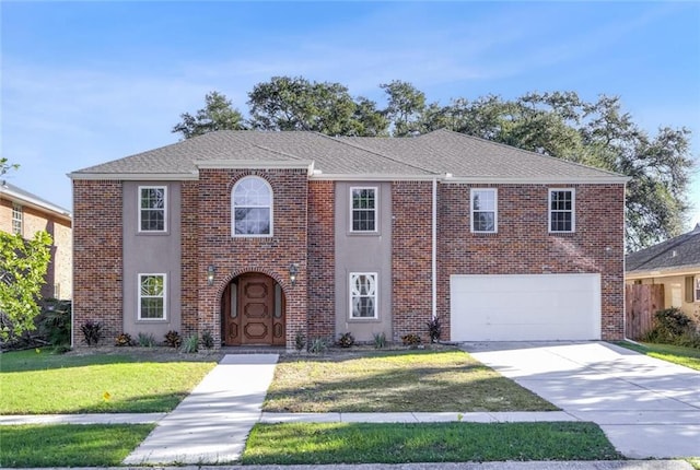 view of front of house with a front lawn and a garage