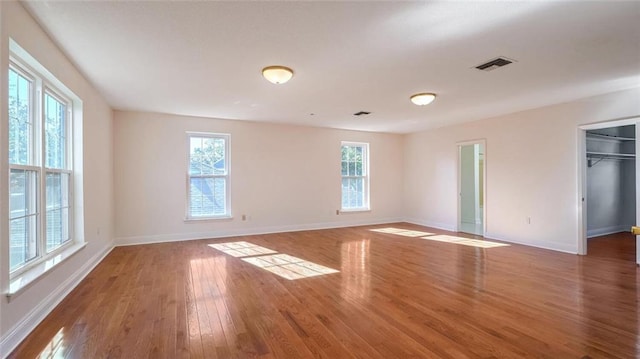 spare room featuring dark hardwood / wood-style flooring