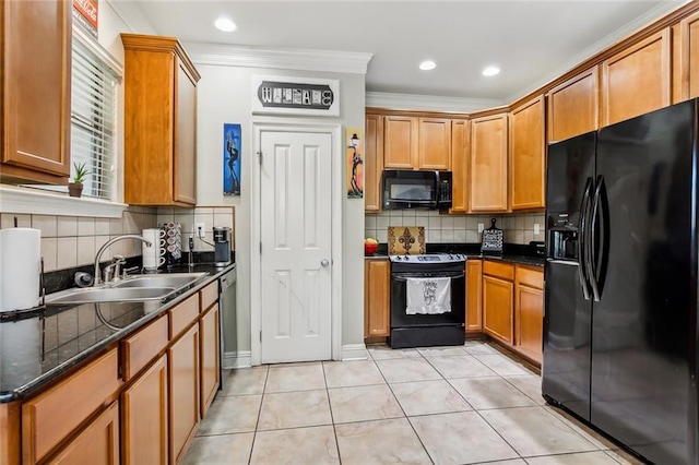 kitchen featuring sink, tasteful backsplash, crown molding, light tile patterned floors, and black appliances