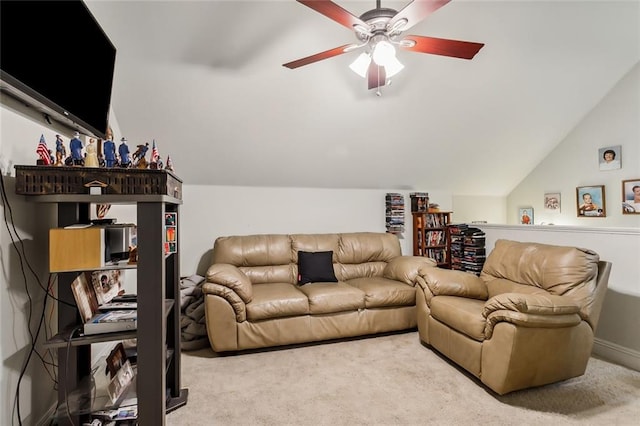 carpeted living room featuring ceiling fan and lofted ceiling