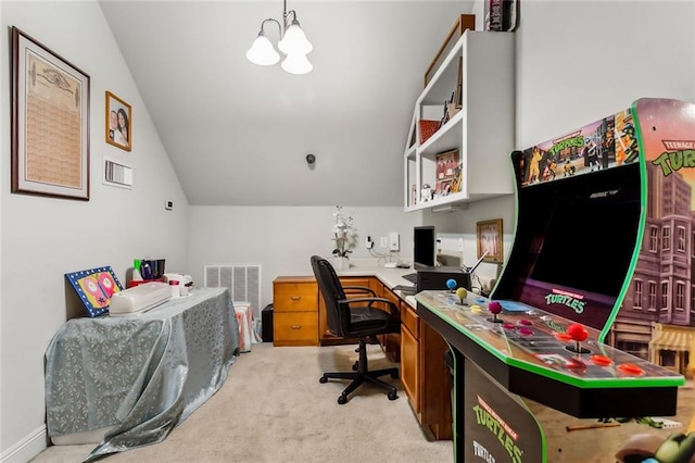 office space featuring a chandelier, light colored carpet, and vaulted ceiling