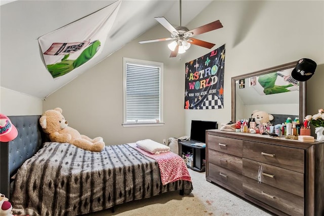 carpeted bedroom with vaulted ceiling and ceiling fan