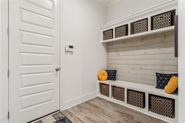 mudroom with baseboards and wood finished floors