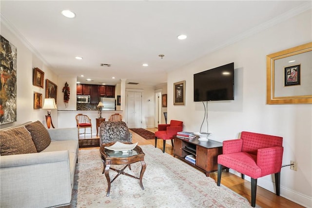 610 N Rampart St Unit F, New Orleans, LA 70112 - living area featuring ornamental molding, recessed lighting, wood finished floors, and baseboards