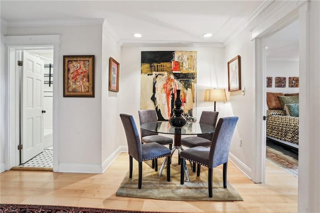 610 N Rampart St Unit F, New Orleans, LA 70112 - dining room featuring light wood finished floors, baseboards, recessed lighting, and crown molding
