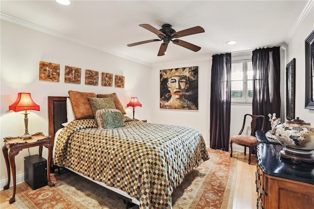 bedroom with ceiling fan and ornamental molding