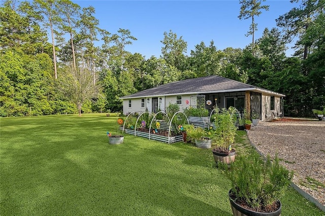 view of community featuring a yard