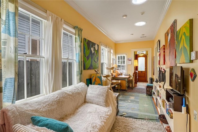 sitting room featuring crown molding and carpet