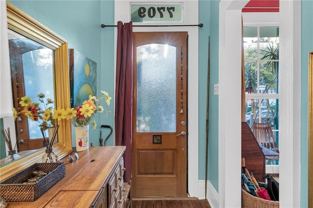 doorway to outside with dark wood-type flooring