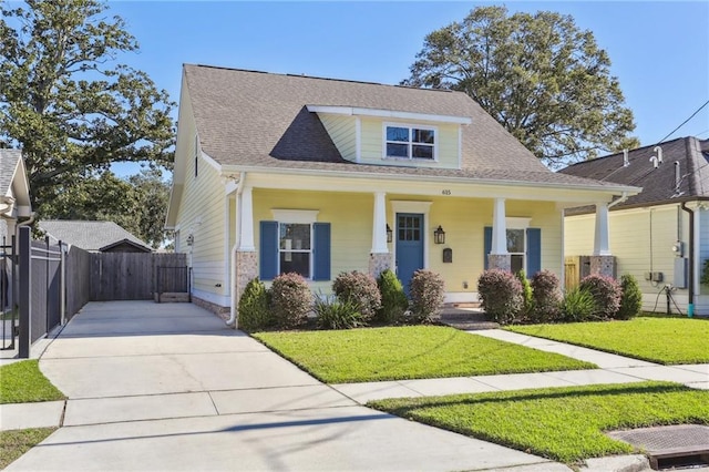 bungalow-style home featuring a porch and a front lawn