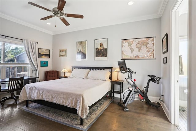 bedroom featuring ceiling fan, dark hardwood / wood-style flooring, ornamental molding, and connected bathroom