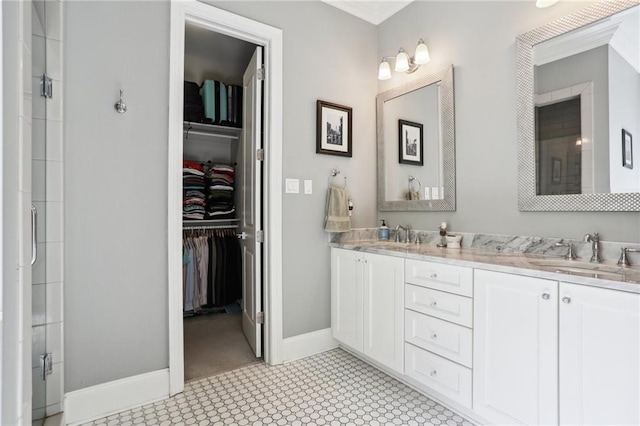 bathroom with vanity and a shower with shower door