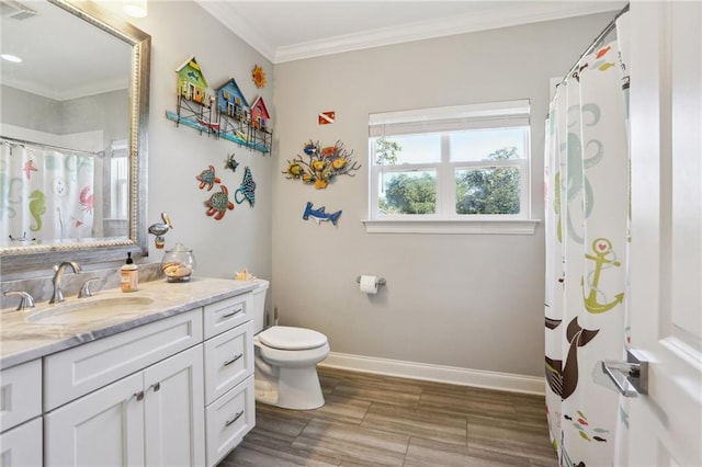 bathroom with hardwood / wood-style floors, vanity, toilet, and ornamental molding