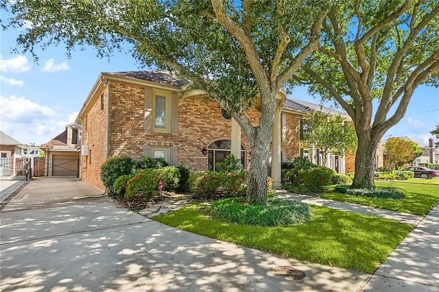 view of front of home with a front yard and a garage