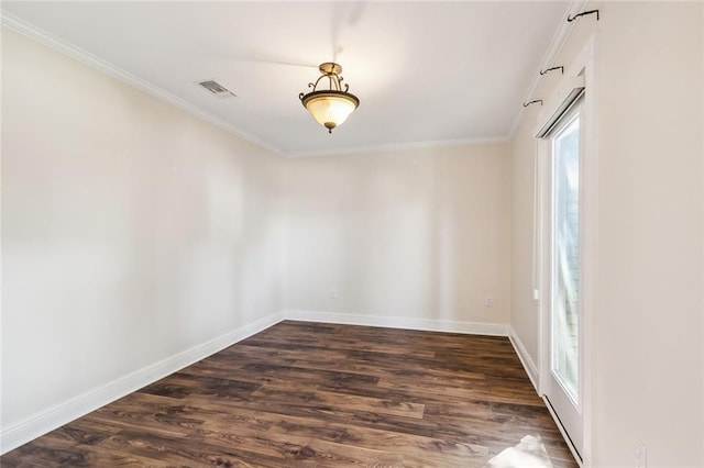 empty room featuring crown molding and dark wood-type flooring