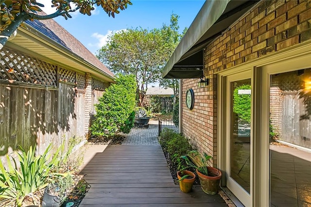 view of side of home featuring a wooden deck