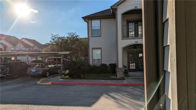 view of property exterior featuring a carport