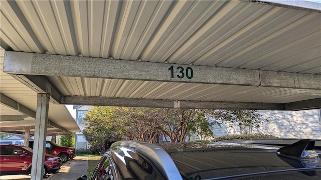 view of parking / parking lot featuring a carport