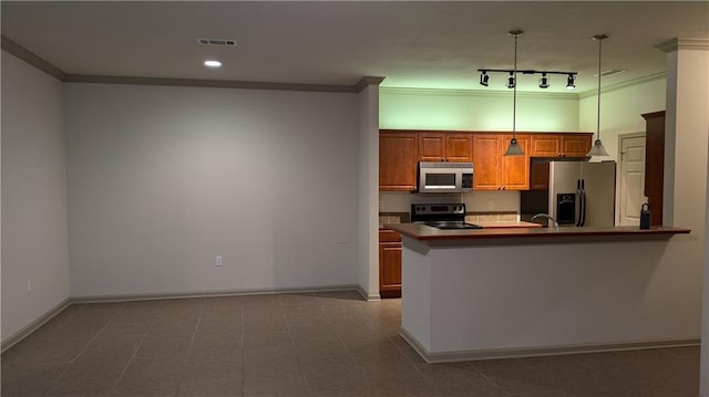 kitchen featuring appliances with stainless steel finishes, hanging light fixtures, kitchen peninsula, crown molding, and track lighting