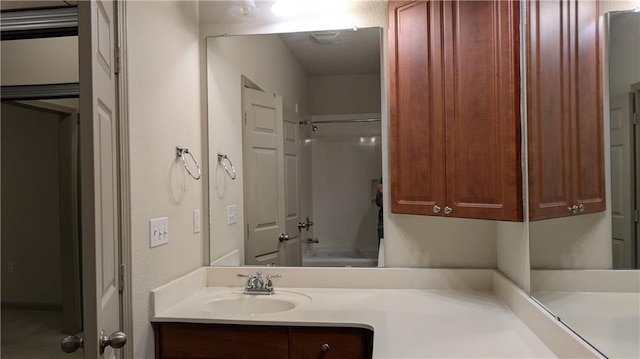 bathroom featuring vanity and shower / bath combination