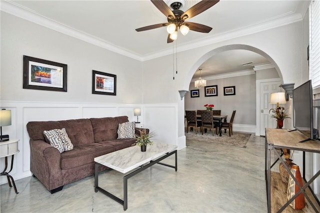 living room with crown molding and ceiling fan