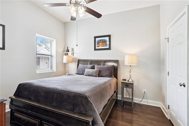 bedroom featuring ceiling fan and dark hardwood / wood-style flooring