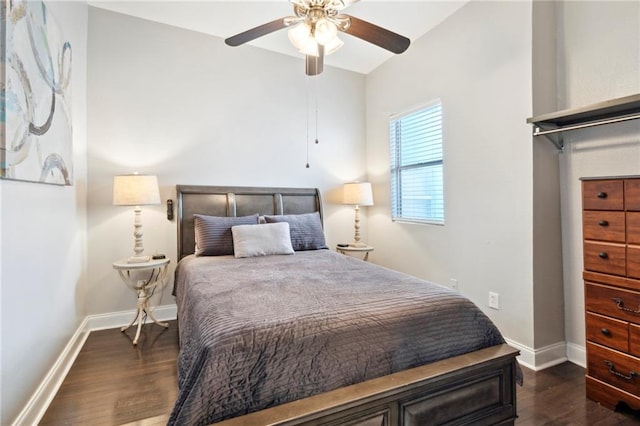 bedroom featuring ceiling fan and dark hardwood / wood-style flooring