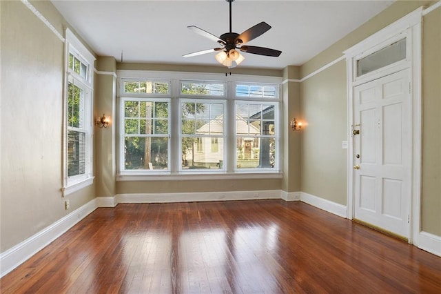 interior space with ceiling fan and a wealth of natural light