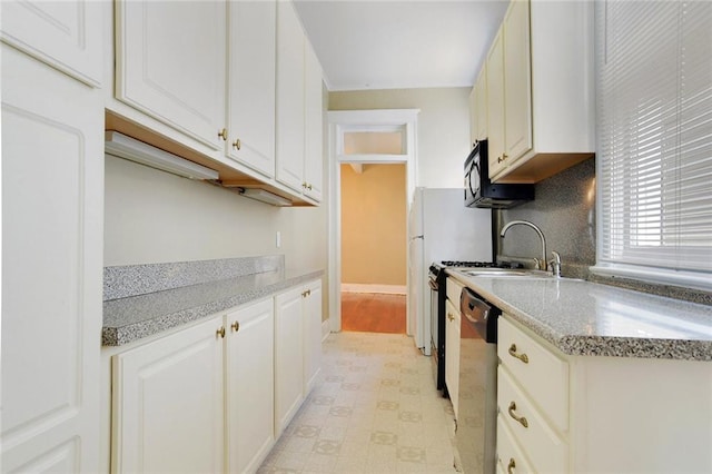 kitchen featuring white cabinetry, dishwasher, and light stone countertops