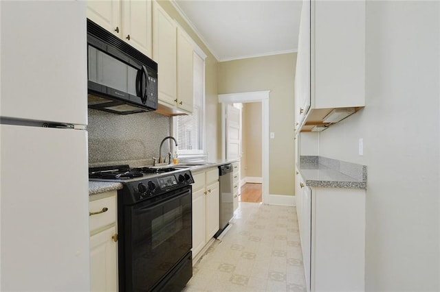 1127 Fern St, New Orleans, LA 70118 - kitchen with black appliances, a sink, tasteful backsplash, white cabinets, and ornamental molding