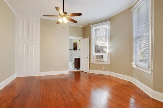 interior space with crown molding, hardwood / wood-style floors, ceiling fan, and a healthy amount of sunlight