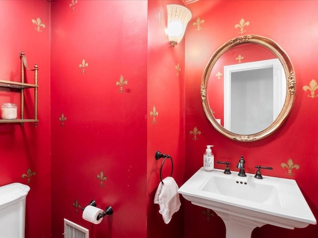 bathroom with toilet and sink