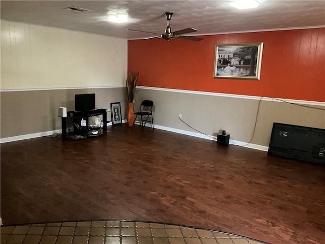 interior space featuring crown molding, ceiling fan, and wood-type flooring