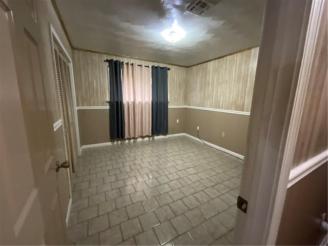 spare room with tile patterned floors