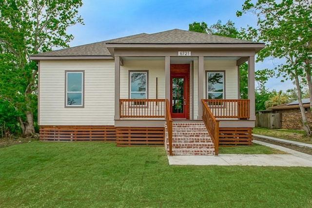 view of front of house with a front lawn and covered porch